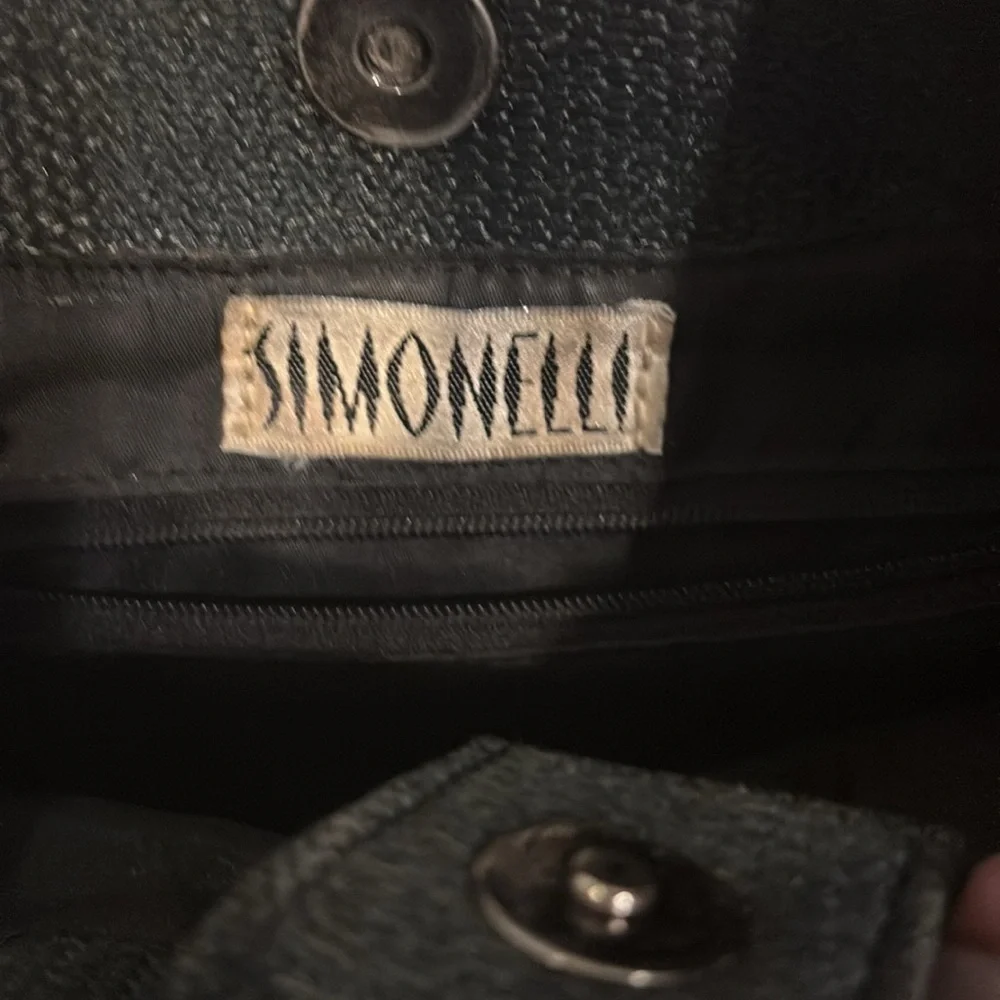 SIMONELLI BRAND BLACK HAND BAG WITH BAMBOO LIKE(ACRYLIC) HANDLES SNAP CLOSURE